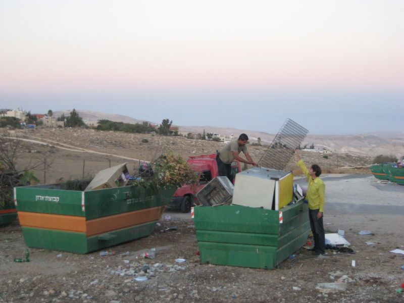 guaka and Noam trying to acquire some metal that can be used as a barbeque.