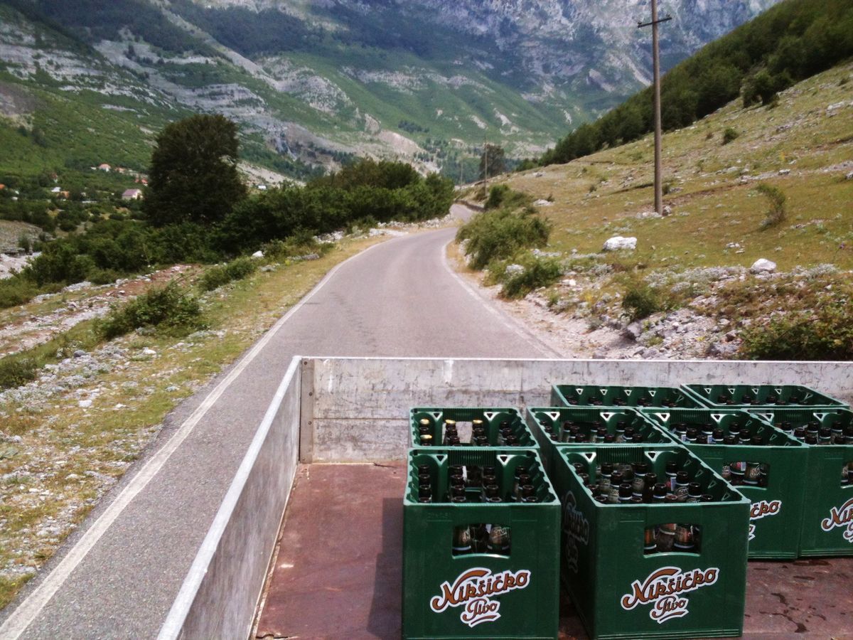 Hitching down from Theth at the back of a truck.