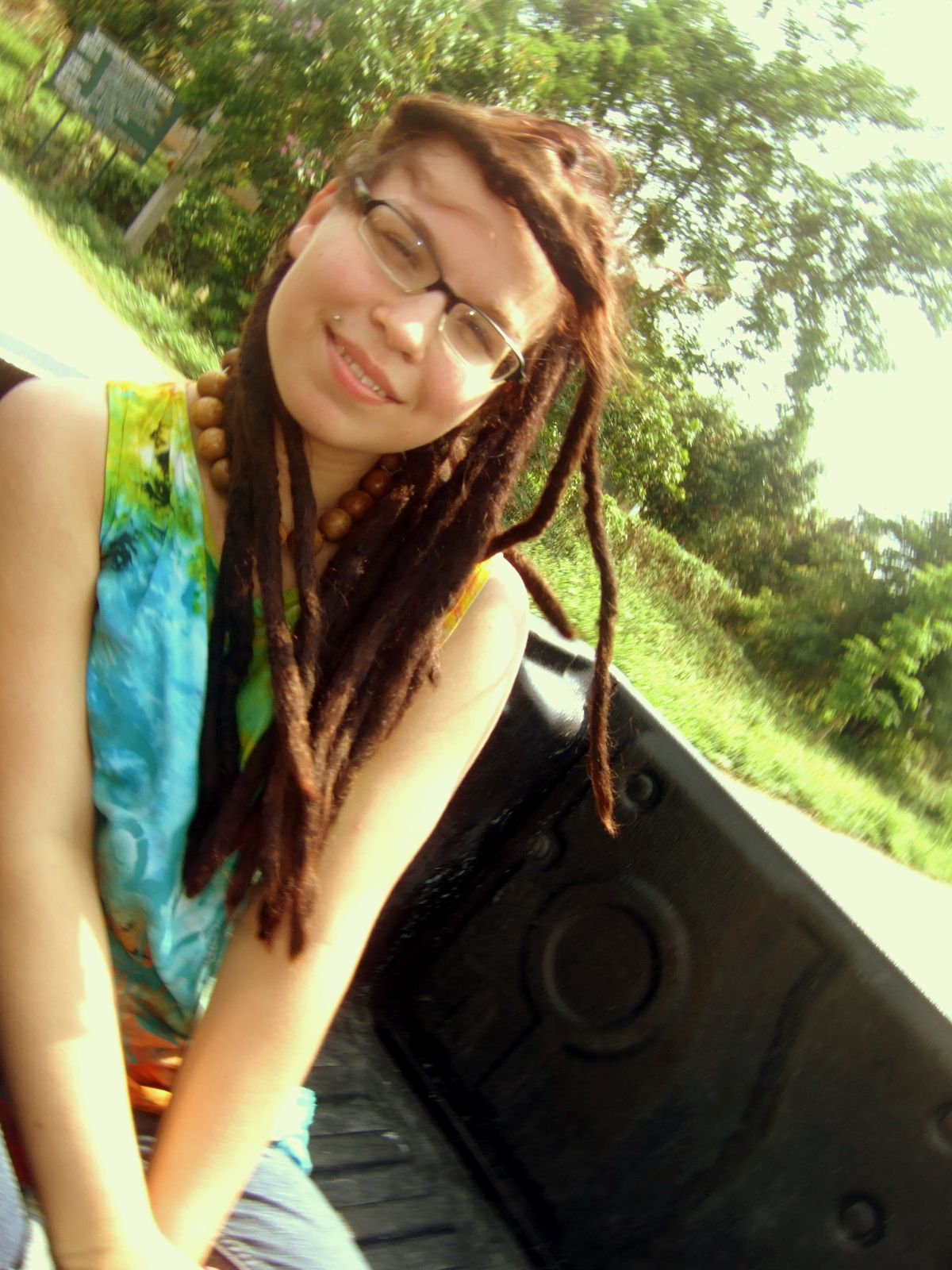 Amylin riding in the back of a hitched pick-up truck from Chiang Rai to the Laos border in Thailand.