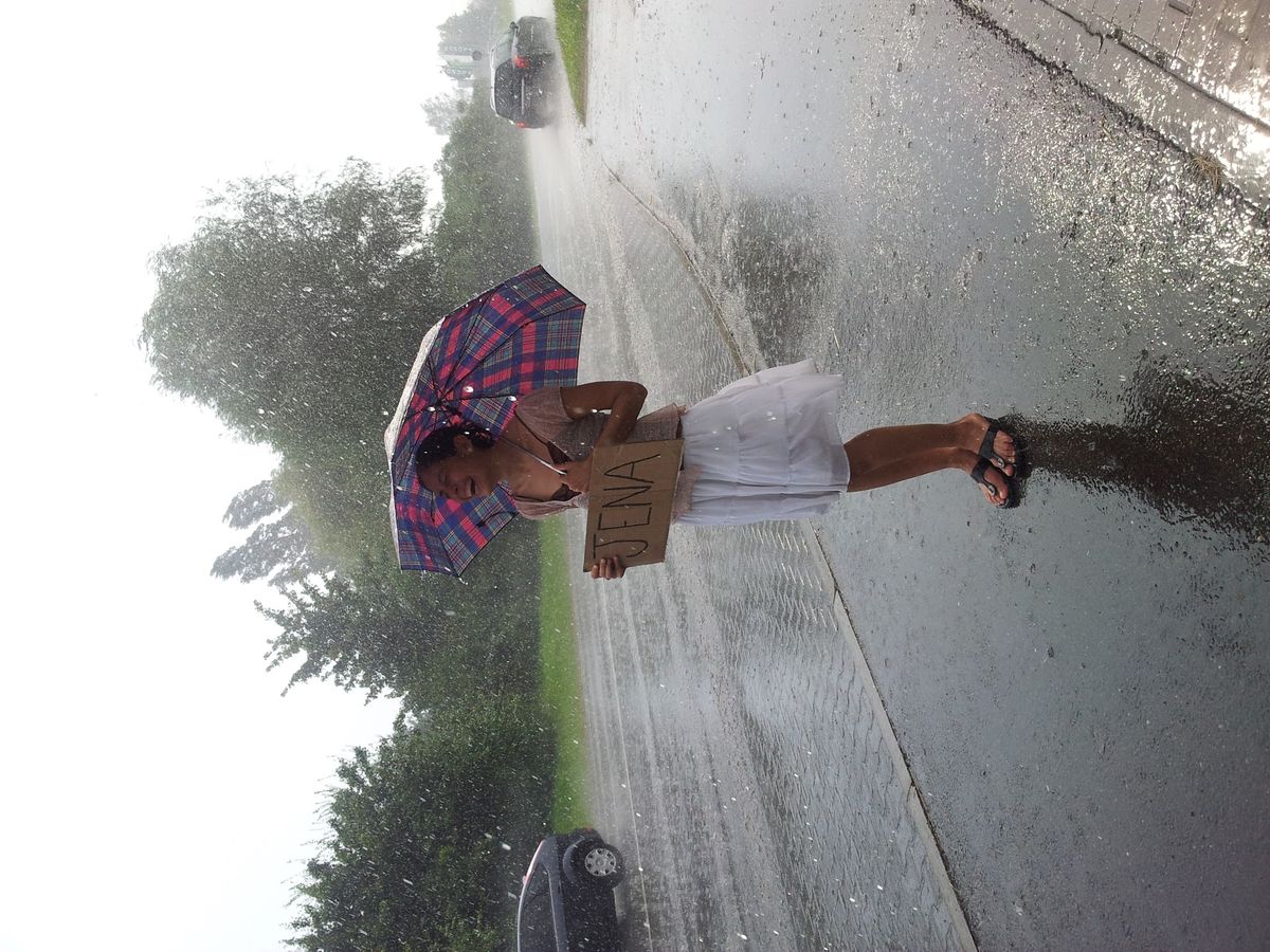 Hitchhiking in the rain.